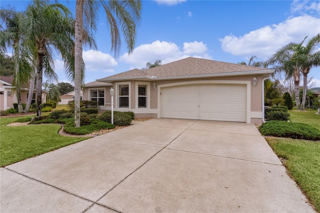 view of front of house featuring a garage and a front lawn