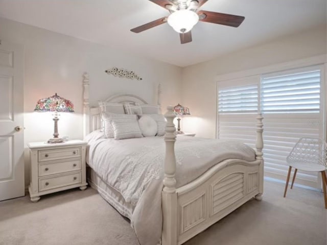 bedroom featuring ceiling fan and light colored carpet