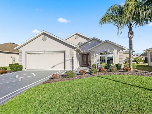 ranch-style house featuring a front lawn and a garage