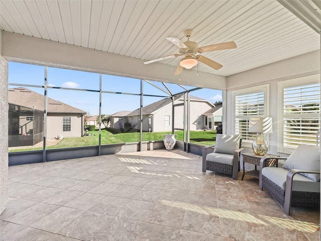 sunroom / solarium with ceiling fan