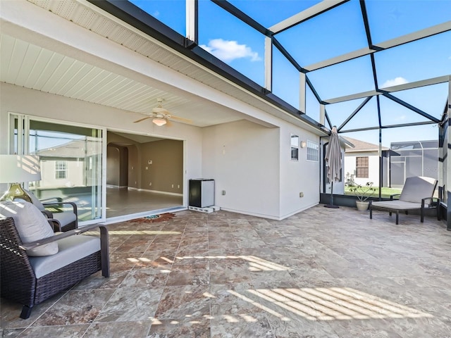 view of patio with a lanai and ceiling fan