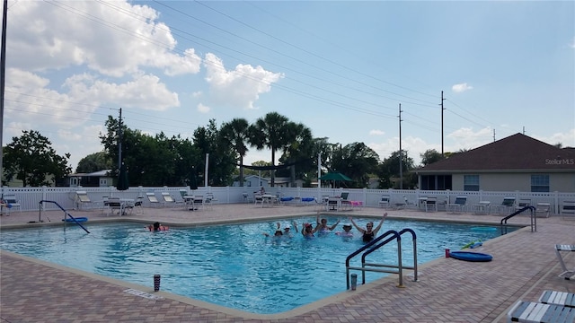 view of swimming pool with a patio