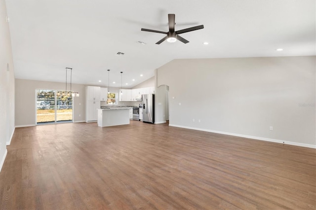 unfurnished living room featuring ceiling fan, dark hardwood / wood-style flooring, and lofted ceiling