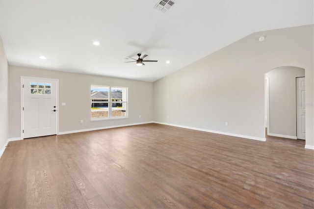 unfurnished living room with ceiling fan, wood-type flooring, and lofted ceiling