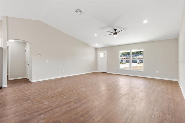 spare room featuring ceiling fan, lofted ceiling, and hardwood / wood-style flooring