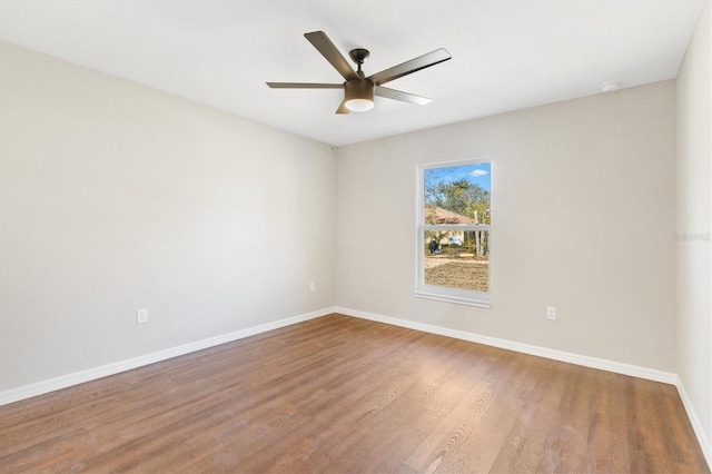 spare room featuring ceiling fan and wood-type flooring