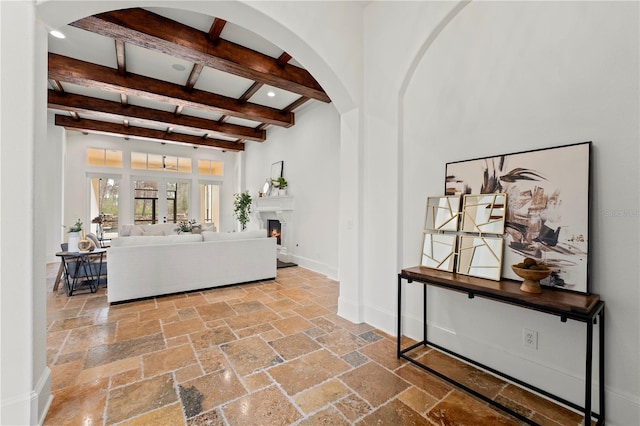 living room featuring beam ceiling