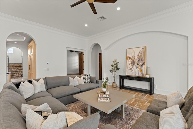 living room with crown molding and ceiling fan