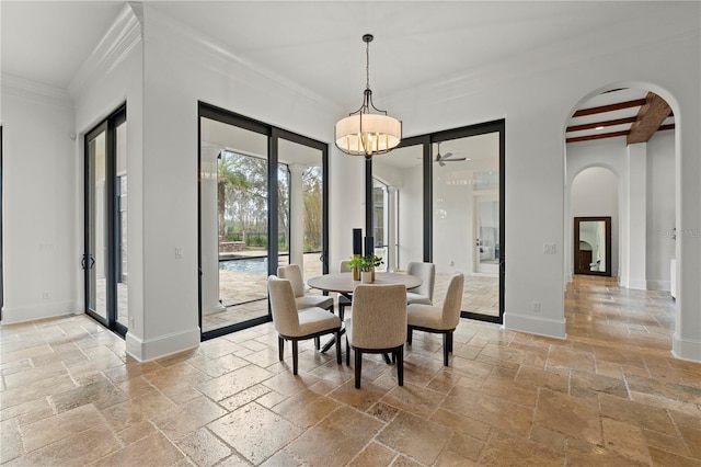 dining room with crown molding and beamed ceiling