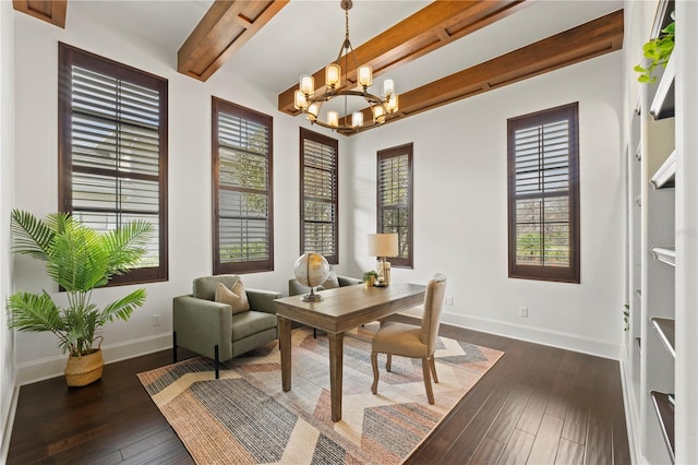 home office with dark hardwood / wood-style flooring, beamed ceiling, and a notable chandelier