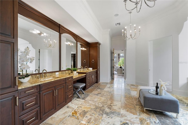 bathroom featuring vanity, crown molding, and an inviting chandelier