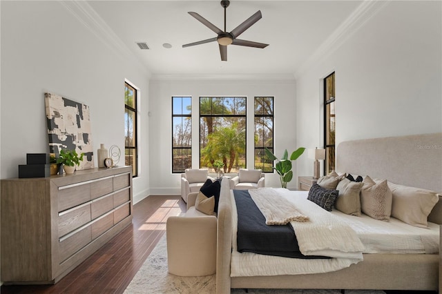 bedroom with dark hardwood / wood-style floors, ceiling fan, and ornamental molding