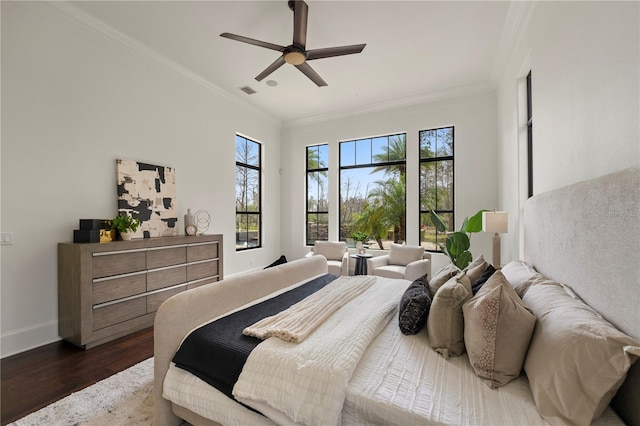 bedroom featuring ceiling fan, dark hardwood / wood-style floors, and ornamental molding