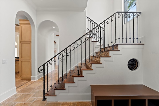 staircase with crown molding