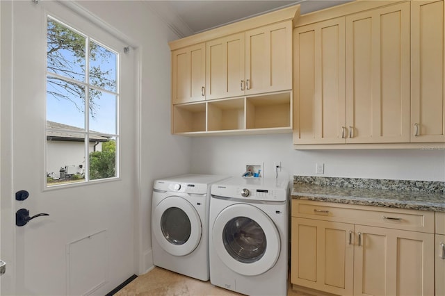 laundry room with cabinets, washer and dryer, and crown molding