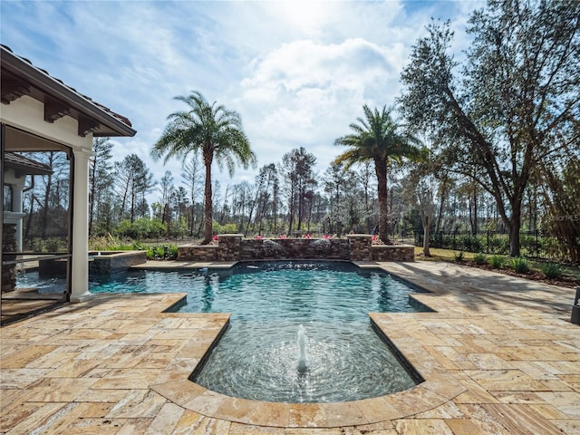 view of swimming pool with an in ground hot tub, pool water feature, and a patio area