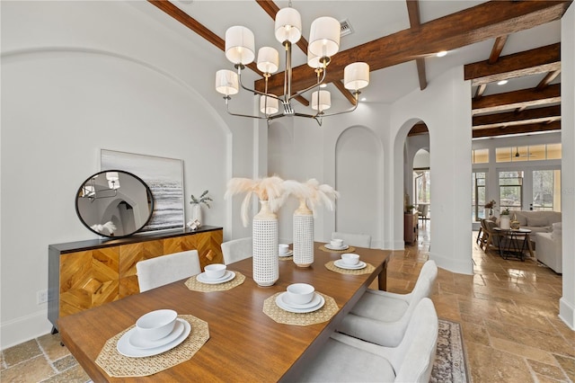 dining room with an inviting chandelier and beam ceiling