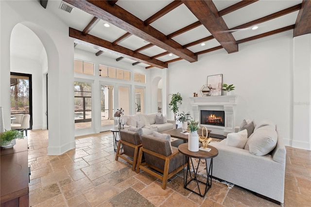 living room with coffered ceiling and beam ceiling