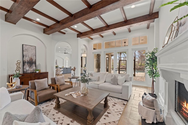 living room featuring beamed ceiling