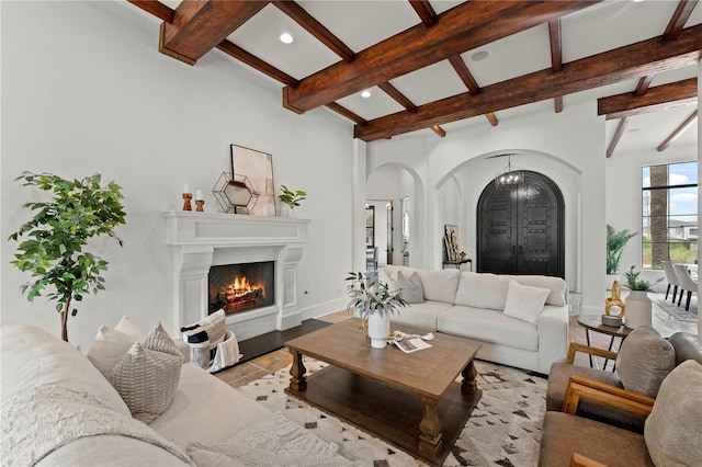 living room featuring beam ceiling