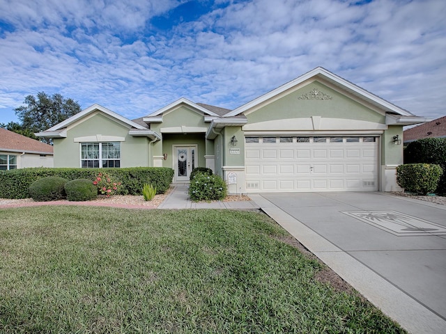 ranch-style home featuring a garage and a front lawn