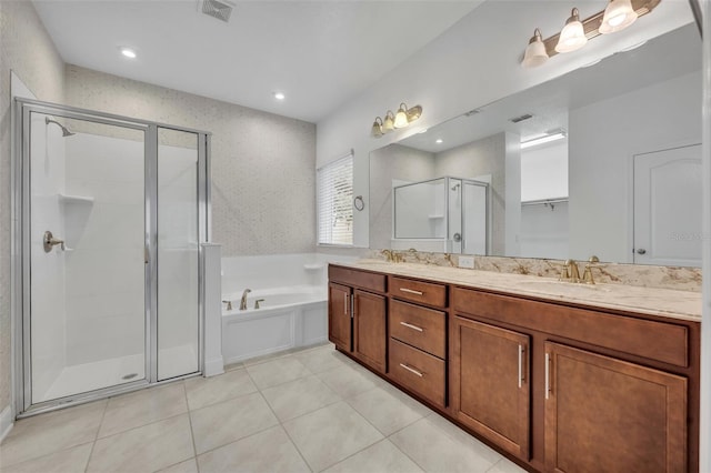 bathroom featuring tile patterned floors, independent shower and bath, and vanity