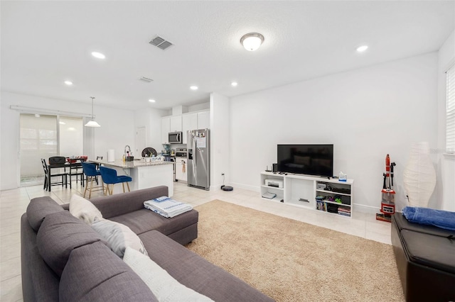 living room featuring light tile patterned flooring