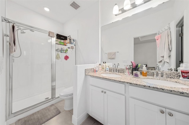 bathroom with vanity, an enclosed shower, tile patterned floors, and toilet