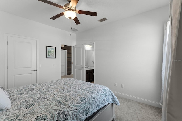 carpeted bedroom featuring ceiling fan and ensuite bathroom