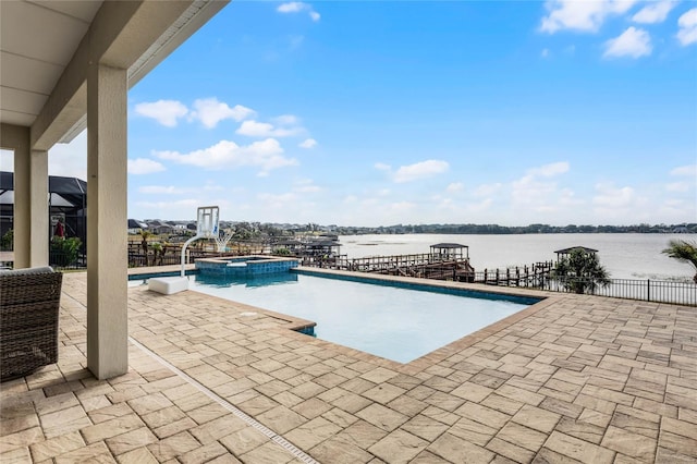 view of swimming pool with an in ground hot tub, a water view, and a patio area