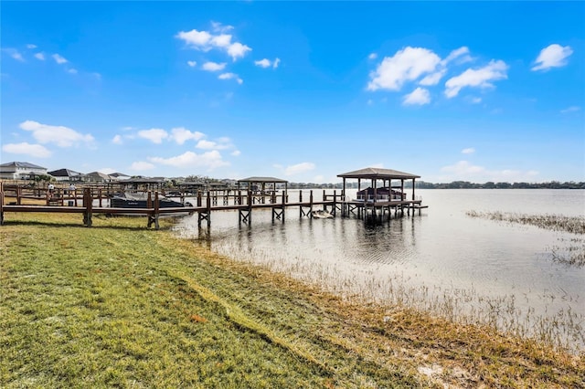 dock area featuring a yard and a water view