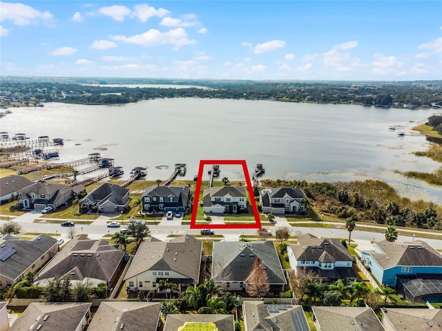 birds eye view of property with a water view