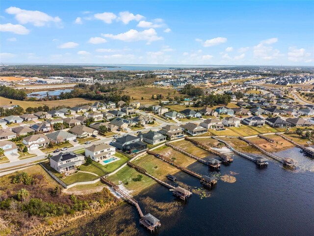 16428 Good Hearth Blvd, Clermont, FL 34711 - aerial overview of property's location with nearby suburban area and a large body of water