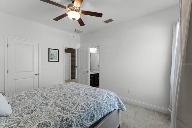 16428 Good Hearth Blvd, Clermont, FL 34711 - carpeted bedroom with baseboards, connected bathroom, and ceiling fan