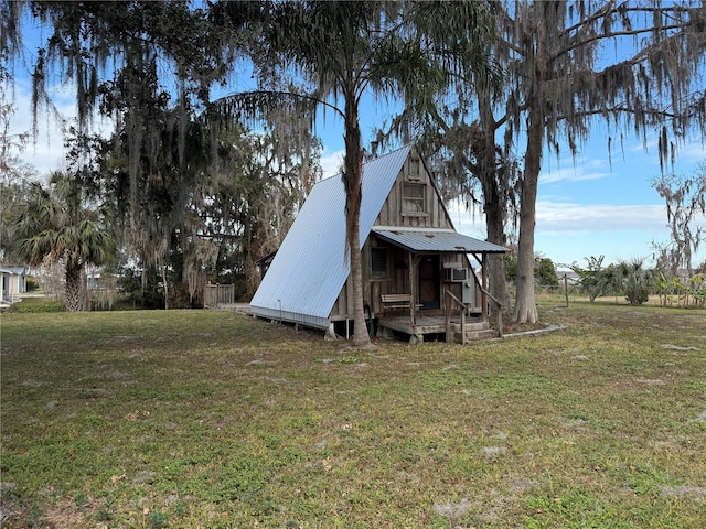 back of property with a yard