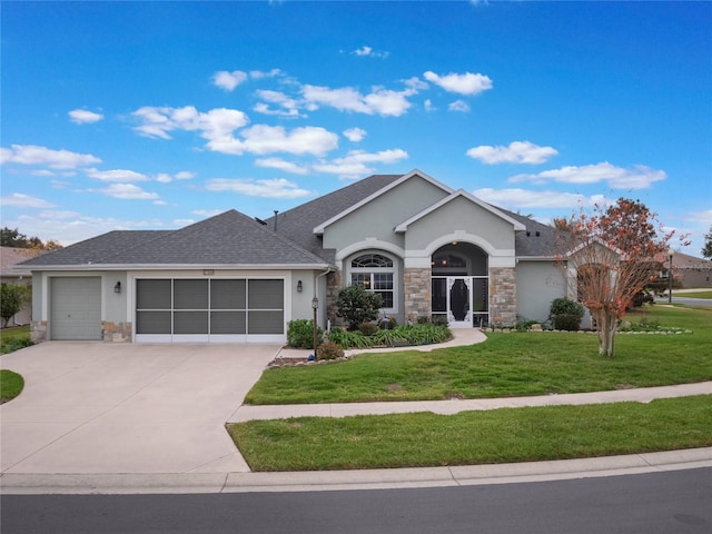 27504 Stoney Brook Dr, Leesburg, FL 34748 - ranch-style home featuring stucco siding, stone siding, a garage, and a front lawn