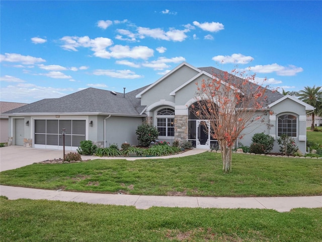 ranch-style home with a front lawn and a garage