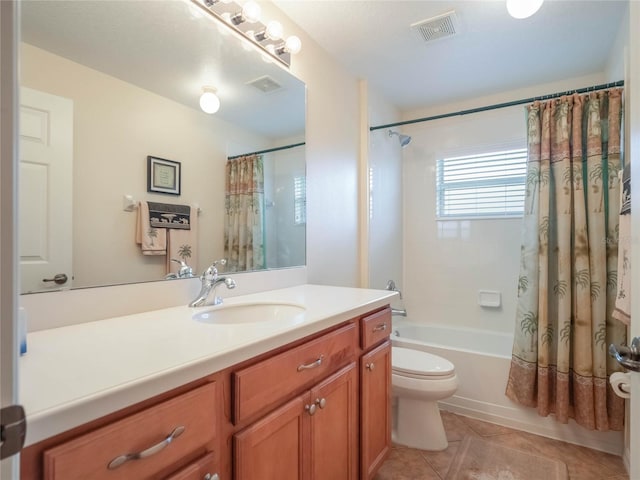 full bathroom featuring tile patterned flooring, toilet, vanity, and shower / tub combo with curtain