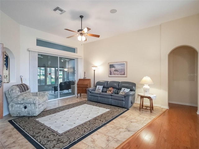 living room with ceiling fan and hardwood / wood-style flooring