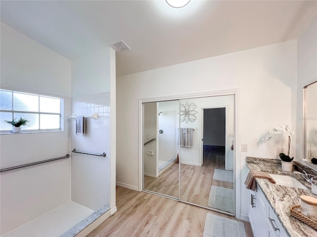 bathroom with wood-type flooring and vanity