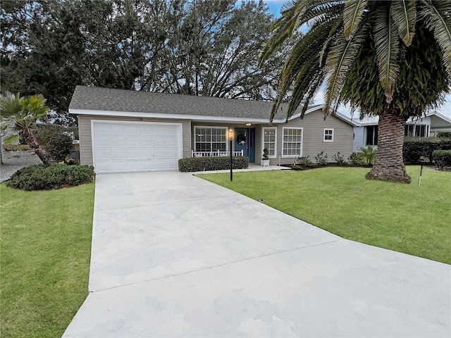 single story home featuring a front lawn and a garage