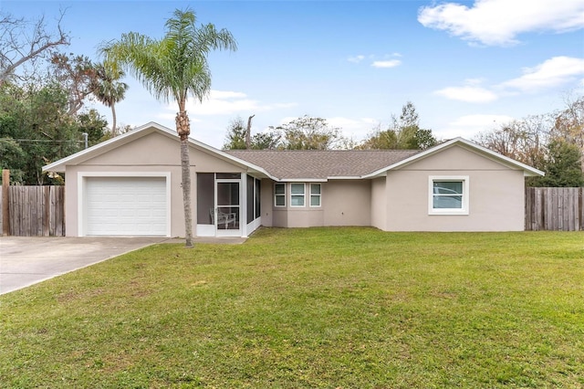 ranch-style house featuring a front lawn and a garage