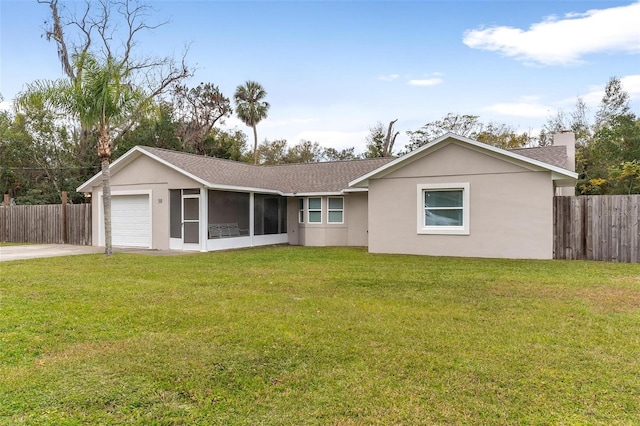 single story home with a sunroom, a front lawn, and a garage