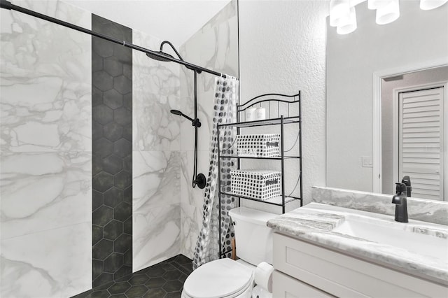 bathroom featuring toilet, a shower with curtain, and vanity