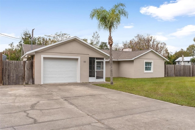 ranch-style house featuring a front lawn and a garage