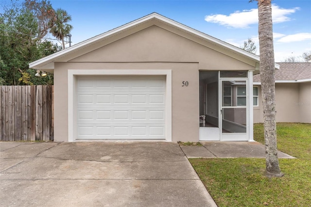 single story home featuring a garage, a front yard, and an outdoor structure