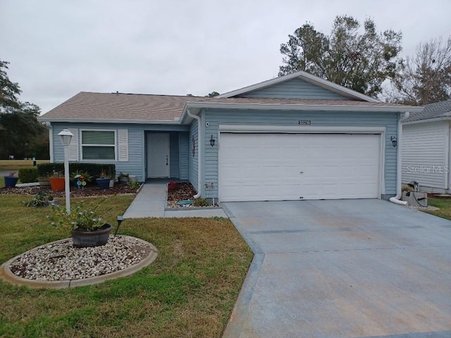 single story home featuring a garage