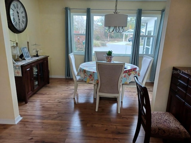 dining space with dark hardwood / wood-style floors