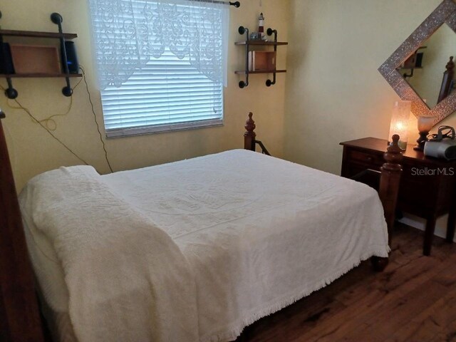 bedroom with wood-type flooring