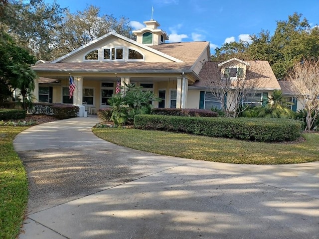 view of front of home with a front lawn and a porch